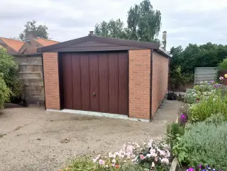 Prestige insulated garage with an apex roof and coloured cladding finish