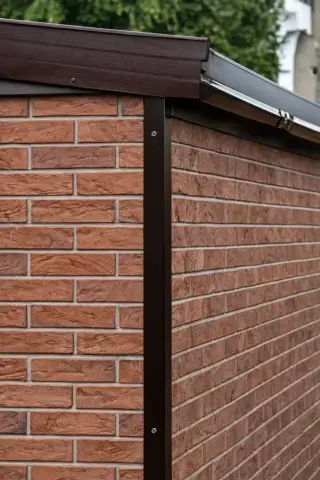 Prestige garage with brick-effect external panels in traditional red bond pattern