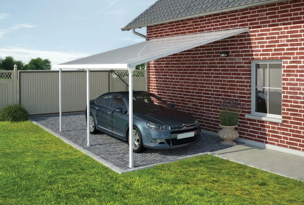 Palram Canopia lean-to carport kit fixed to a house wall, aluminium frame and polycarbonate roof