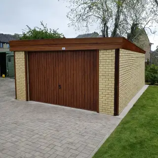 Prestige insulated garage with a pent roof and coloured cladding finish