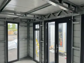 Interior view with glazed doors and roof structure